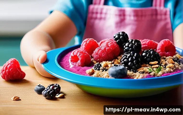 어린이를 위한 항염증 식단 구성 방법 - A vibrant and colorful children’s smoothie bowl featuring a mix of fresh blueberries, raspberries, a...